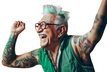 70 year old senior man with green hair, tattoos and earrings stretches his arms up exuberantly. He is happy and laughing. 