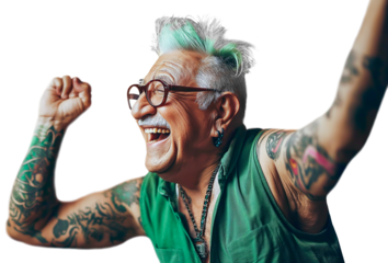 70 year old senior man with green hair, tattoos and earrings stretches his arms up exuberantly. He is happy and laughing. 