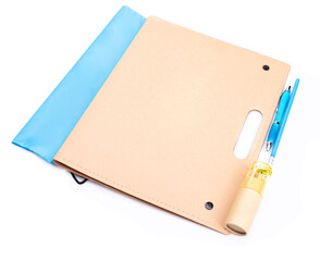Closed folder with school or office supplies, isolated.