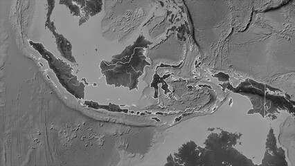 Indonesia outlined. Grayscale elevation map
