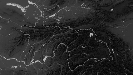 Tajikistan outlined. Grayscale elevation map © zelwanka