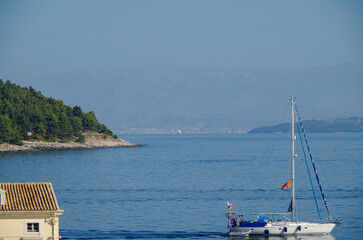 Romantic backstreet, side street or alleys in historic old town of Corfu Island, Greece with...