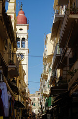 Romantic backstreet, side street or alleys in historic old town of Corfu Island, Greece with...