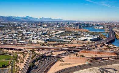 Freeway Interchange aerial view of the Loop 101 and Loop 202 looking West at Tempe and Phoenix, Arizona in 2024