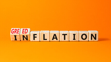 Inflation or greedflation symbol. Concept word Inflation Greedflation on beautiful wooden cubes. Beautiful orange table orange background. Business inflation greedflation concept. Copy space.