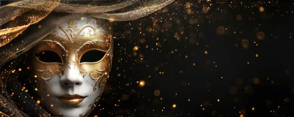 Poster Venetian carnival mask with shiny golden streamers and glitter on black background. Carnival party concept. Festive backdrop for design card, banner, flyer with copy space © ratatosk
