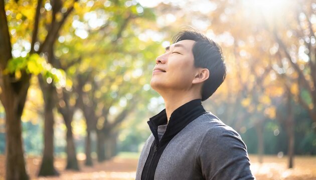 Calm Man Outdoors Relaxing And Breathing In Deeply In Autumn Park.ai generated
