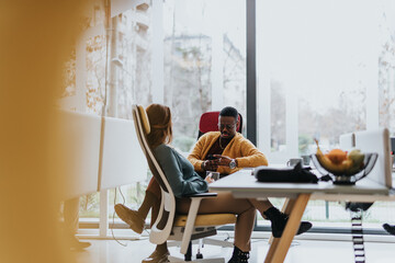 Diverse employees collaborating on innovative ideas for business success in a modern office.