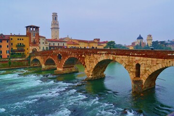 Obraz premium view of the ancient Ponte Pietra over the Adige river in the city of Verona, Italy