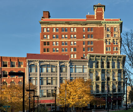 view of downtown Binghamton buildings at sunset golden hour (historic architecture including the press building on court street and chenango) autumn colors at dusk small town, city upstate new york NY