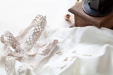 Lace braid lie on white fabric....