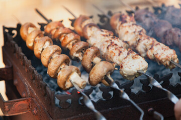 Appetizing mushrooms are fried on the grill....