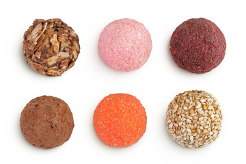 A variety of different truffles in a wooden bowl Isolated on a white background. Top view. Flat lay