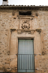 Fototapeta na wymiar Coat of arms made of carved stone in the old town of Priego