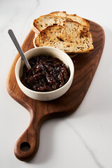 Delicious French Appetizer Freshly Cooked Onion Confit or confiture. Also known as Onion Marmalade or Jam or Chutney. Homemade from sweet onions with Porto wine and spices. Top view.
