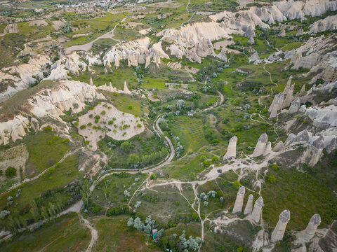 Fairy chimneys aerial view in Love Valley (Asiklar Vadisi) in Goreme Historic National Park in Cappadocia, Anatolia, Nevsehir Province, Turkey. Goreme Historic National Park is a World Heritage Site. 