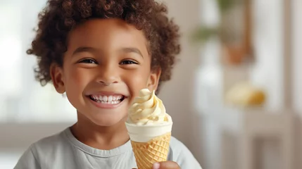 Foto auf Alu-Dibond Young child with a big smile holding a vanilla ice cream cone in a bright indoor setting © Natasha 