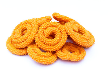 Indian snacks food murukku on white background side view 