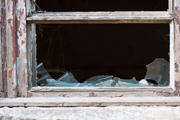 Smashed glass Window with old wooden frame. old window. finely broken glass. old house, retro....