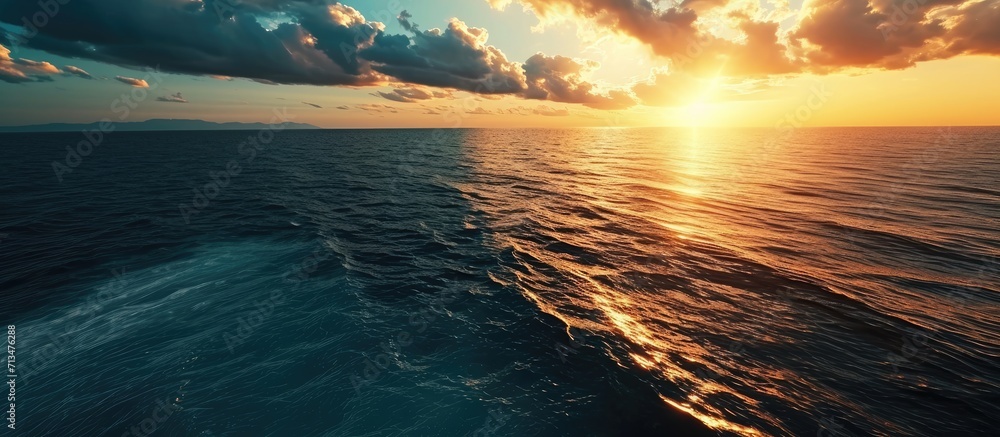 Poster aerial view over beautiful ocean during sunset top view to the ocean in summer day while sunset clos