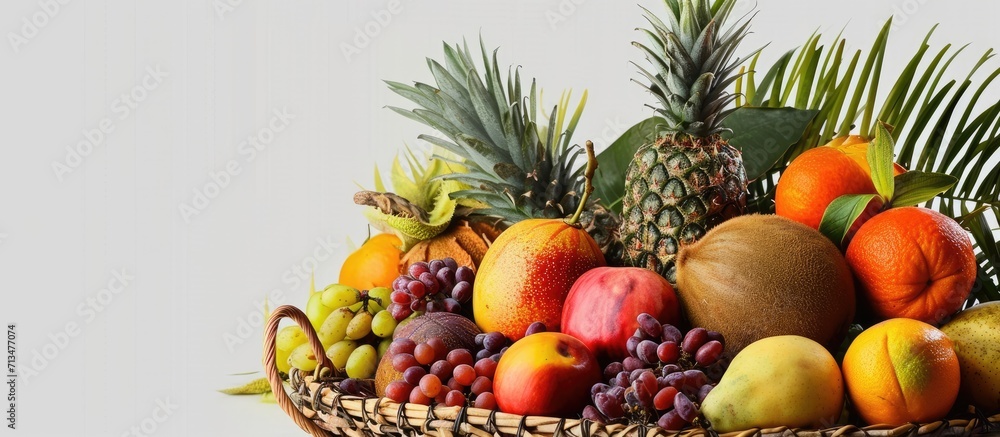 Aufkleber Assortment of exotic fruits in basket isolated on white. Copy space image. Place for adding text or design