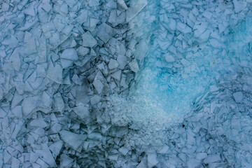 Aerial view about piled up ice floes on lake Balaton at Fonyódliget, Hungary. Abstract ice formation background.