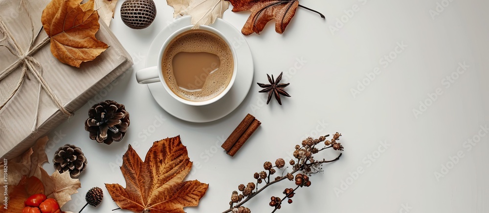 Poster autumn or winter composition cup of coffee gift dried autumn leaves beige sweater on white backgroun