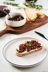 Delicious French Appetizer Freshly Cooked Onion Confit or confiture. Also known as Onion Marmalade or Jam or Chutney. Homemade from sweet onions with Porto wine and spices. Top view.