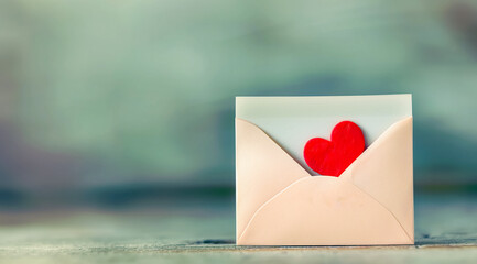 Fototapeta premium valentines day love letter with a cute red heart inside
