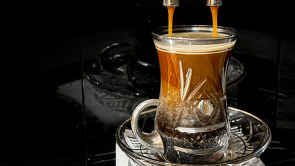 Crystal cup of brewed espresso coffee