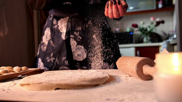Girl pours flour on a board