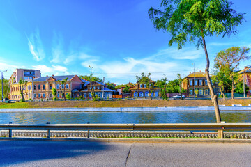 City street with old vintage wooden and stone houses and buildings.Russian folk style in...