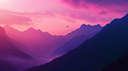The silhouettes of the mountains create a magical contrast with a gamut of pink and purple sunset,