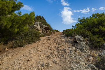 Stone path to Anthony Quinn Bay Beach Viewpoint - Rhodes Greece..​