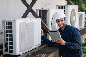 Portrait of Engineers is checking the air conditioning cooling system of a major building or...