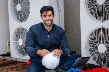 Portrait of Engineers is checking the air conditioning cooling system of a major building or...