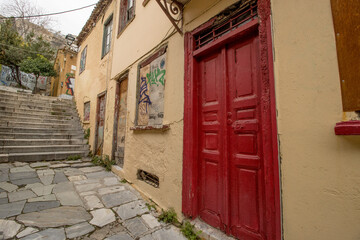 Narrow Street and walkway and houses in the Plaka neighborhood going up to the slopes of the...
