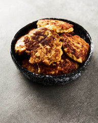  Golden Brown Chopped Chicken Cutlets or Patties with mozzarella cheese on concrete background.