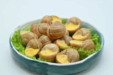 macro snails with white sauce photo above, snails with basil pesto, Grana Padano and pine nuts	

