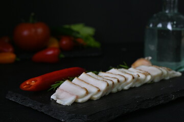 Ukrainian lard with vodka and red pepper, alcoholic feast concept 