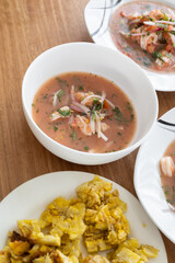 decoration of plate with shrimp ceviche, traditional food from Ecuador, studio photo as wallpaper, healthy food