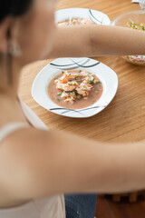 shrimp ceviche with shrimp, onions, tomato and spices as ingredients, studio photo for restaurant menu, healthy soup with seafood