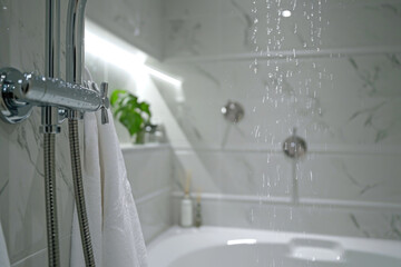 A bathroom featuring a shower head and a bathtub. Suitable for home improvement or interior design concepts