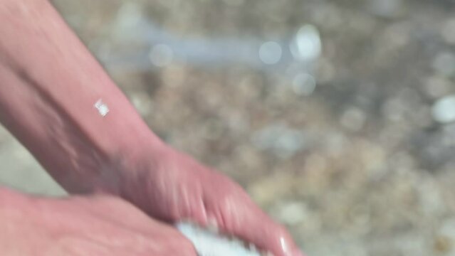 Man Cleaning Fish. Close Up
