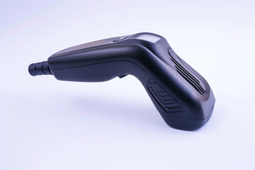 A black hair dryer placed on a clean white surface. Suitable for beauty and haircare themes