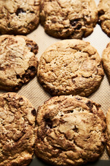 Halva Cookies with chocolate on baking pan.