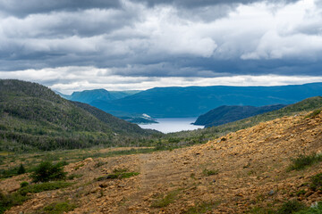 Fototapeta na wymiar Tablelands in Gros Morne National Park, a Canadian national park and World Heritage Site in Newfoundland. An area where earth's mantle is exposed. Fjord Inner Bonne Bay South Arm. 
