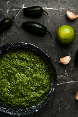 Jalapeno Pesto. Pesto made from basil leaves with jalapeno peppers, lime juice with garlic, walnuts and olive oil.