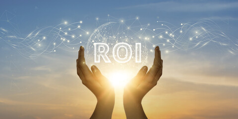 ROI. Man Holding Global Network and Connecting Data of Return on Investment with Business on the...