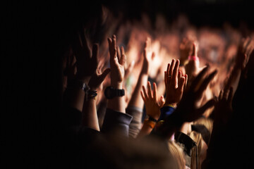 Hands, crowd or audience or music festival at night for a party or event of celebration together. Concert, disco or dance with a group of people outdoor at a carnival for performance or entertainment - obrazy, fototapety, plakaty
